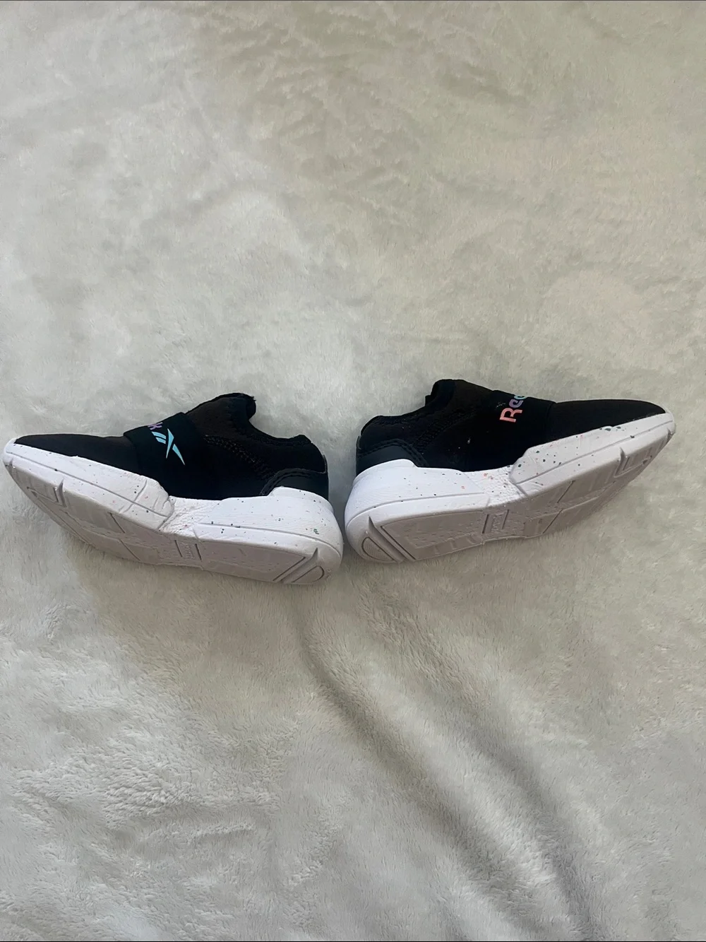 Reebok Kids Black Slip-On Sneakers with Rainbow Logo Accent